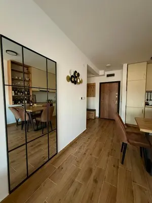 a living room with a table and a dining room at Wine story in Irig
