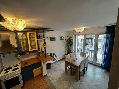 a kitchen with a table and a dining room at Sky Rooftop Huge Apartment in Belgrade