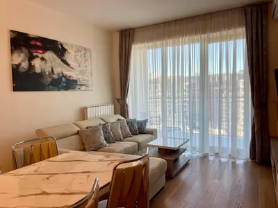 a living room with a couch and a table at The Gates 104 in Belgrade