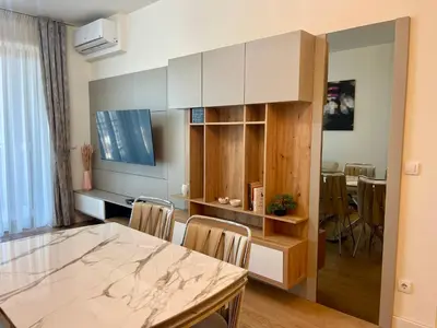 a kitchen and dining room with a table and chairs at The Gates 104 in Belgrade