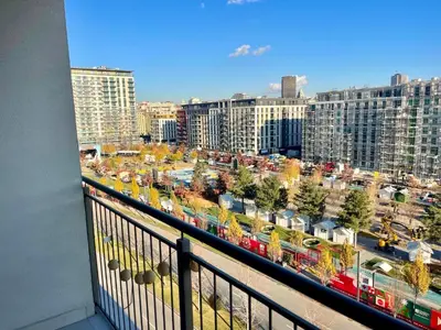 a balcony with a view of a city with buildings at The Gates 104 in Belgrade