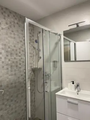 a bathroom with a shower and a sink at FlyInn Residence in Belgrade