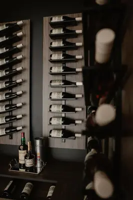 a bunch of bottles of wine in a wine cellar at Diwine Spa House Fruška Gora in Irig