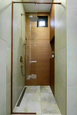 a shower with a glass door in a bathroom at Tasmajdan park, 15 minutes by walk to Knez Mihajlova Centar in Belgrade
