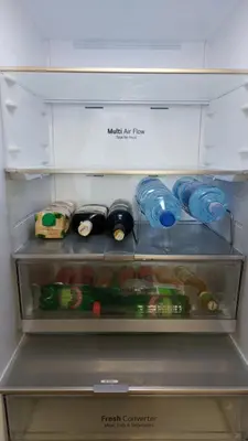 a refrigerator drawer filled with bottles and other items at Belgrade Waterfront Terra Apartments in Belgrade