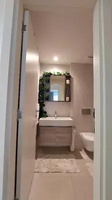 a bathroom with a sink and a mirror and a toilet at Belgrade Waterfront Terra Apartments in Belgrade