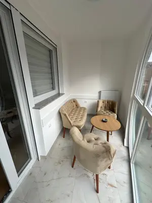 a room with two chairs and a table and a window at Apartman Aranđelovac2 in Arandjelovac