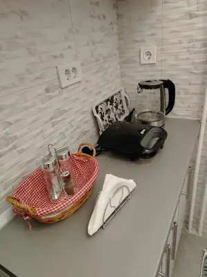 a kitchen counter with a blender and glasses on it at Star Apartment Belgrade 1 in Belgrade