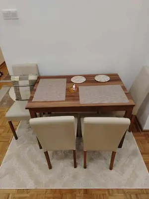 a dining room table with two chairs and a table at Star Apartment Belgrade 1 in Belgrade