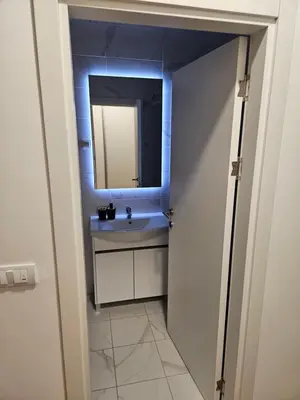 a bathroom with a sink and a mirror at MiS Lux in Mladenovac