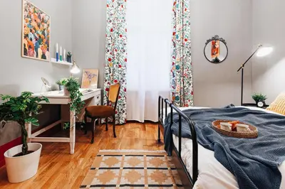 a bedroom with a desk and a bed with a bedspread at Air Hockey Joy Old Town Heart in Belgrade