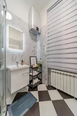 a bathroom with a sink and a mirror at Capitol Apartment Belgrade in Belgrade
