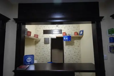 a door into a room with a sign on the wall at Franstal Apartments in Belgrade