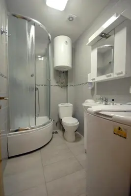 a bathroom with a shower and a toilet and a sink at Franstal Apartments in Belgrade