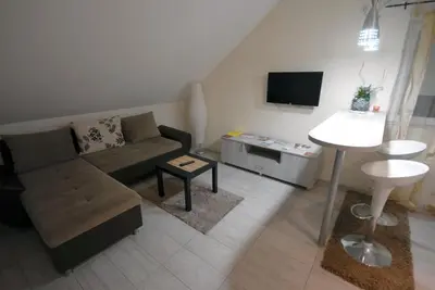 a living room with a couch and a table at Franstal Apartments in Belgrade