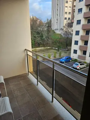 a balcony of a building with a view of a street at Miss Lux in Mladenovac