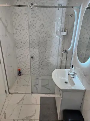 a bathroom with a shower and a sink at Miss Lux in Mladenovac