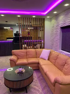 a living room with a couch and a table at Apartman Andrej in Belgrade