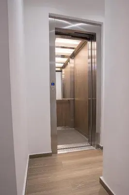 a hallway with a door leading into a room at M Corner in Belgrade