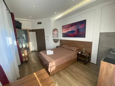 a hotel room with a bed and a mirror at M Corner in Belgrade
