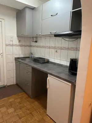 a kitchen with a sink and a counter top at Kosovska Street in Belgrade