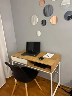 a desk with a laptop computer on top of it at Marse Stay in Belgrade
