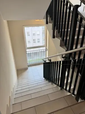 a staircase with a large window in a building at Marse Stay in Belgrade