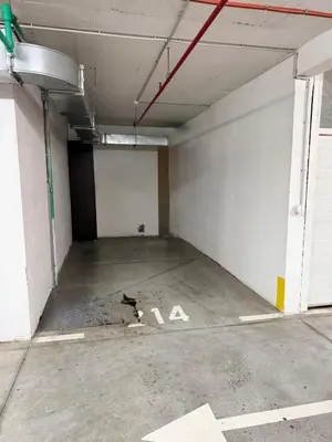 an empty parking garage with the letter a on the floor at Marse Stay in Belgrade