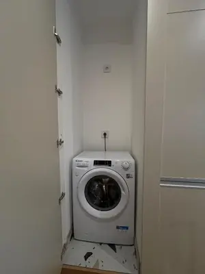 a washer and dryer in a small room at Skadarlija Urban Nest in Belgrade