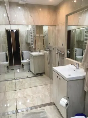 a large bathroom with two sinks and a shower at Apartman Jovanovic in Belgrade