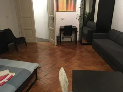 a living room with a couch and a table at Apartman Jovanovic in Belgrade