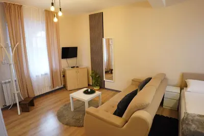 a living room with a couch and a table at Apartmani Kula Novi Banovci Svetosavska 137 in Belgrade