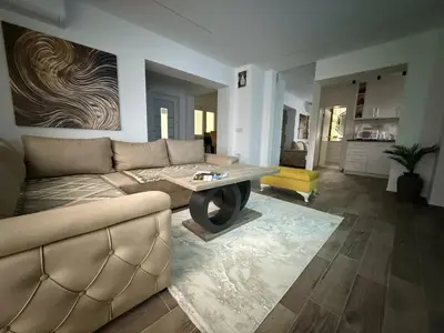 a living room with a couch and a table at Apartman 28 in Arandjelovac