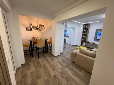 a living room with a couch and a table at Apartman 28 in Arandjelovac