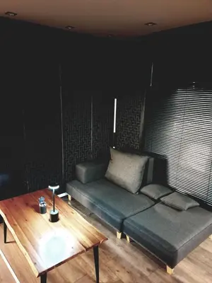 a living room with a couch and a coffee table at Bright Room Houseboat in Belgrade