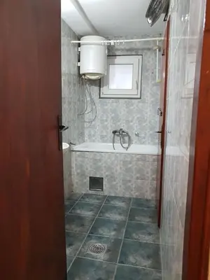 a bathroom with a bath tub and a sink at Ozon in Belgrade