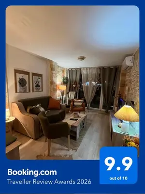 a living room with a couch and a table at Apartman A 24 in Belgrade