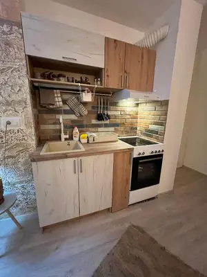a small kitchen with a sink and a stove at Apartman A 24 in Belgrade