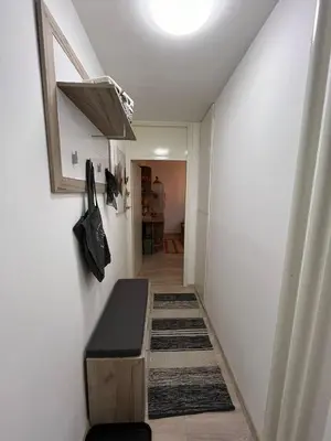 a hallway with a stairway with a bench in a room at Apartman A 24 in Belgrade