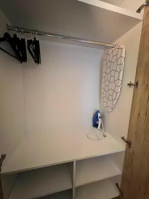 a walk in closet in a house at Tomin sokak Apartment in Belgrade