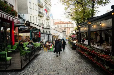 a group of people walking down a street at Tomin sokak Apartment in Belgrade