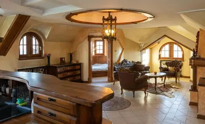a living room with a chandelier and a dining room at Royal Casa in Belgrade