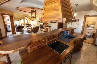 a kitchen with a wooden counter top in a room at Royal Casa in Belgrade