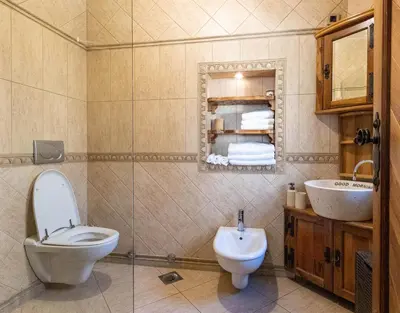 a bathroom with a toilet and a sink at Royal Casa in Belgrade