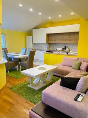 a living room with a couch and a table at Zemun Belgrade Apartment in Belgrade