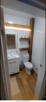 a bathroom with a white toilet and a sink at The Old Courtyard in Belgrade