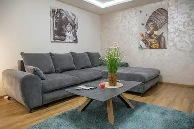 a living room with a couch and a table at The Old Courtyard in Belgrade