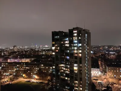 a view of a tall building at night at Danube Riverview in Belgrade