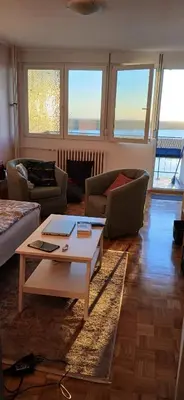 a living room with a couch and a coffee table at Danube Riverview in Belgrade