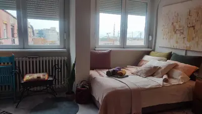 a bedroom with a bed with two stuffed animals on it at CoCo Studio Bright & Stylish Apartment in Central Belgrade in Belgrade